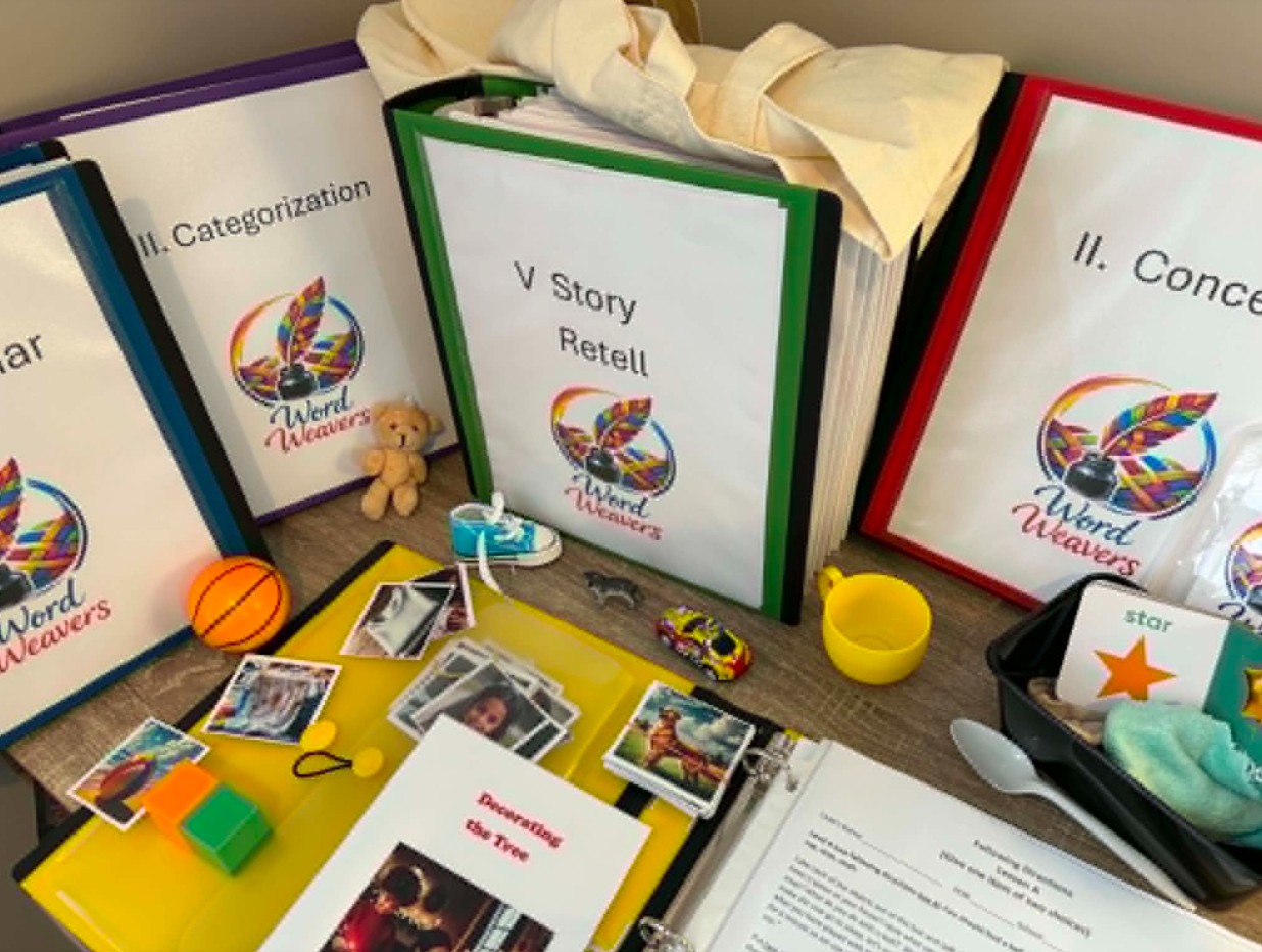 The Word Weavers kit — five binders, toys, picture cards and stories
